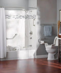 Modern bathroom featuring 24 Inch Bathroom Grab Bar With Towel Bar In Brushed Nickel, shower and towel rail visible for accessibility.