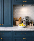 Top Shelf Antique Brass Cabinet Knobs And Drawer Pulls 10 Pack Heavy Duty Solid Metal Handles rust proof on blue kitchen cabinets.