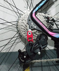 Rear Derailleur For Six To Eleven Speed Bicycles With Red Hanger Extender For Mountain And Road Bikes, shown on wheel