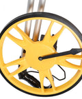 Close-up of the yellow wheel of FTVOGUE Distance Measuring Wheel, Foldable Measuring Wheel, Mechanical Counter 0 to 9999.9 M 12.6 in.