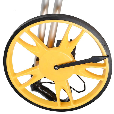 Close-up of the yellow wheel of FTVOGUE Distance Measuring Wheel, Foldable Measuring Wheel, Mechanical Counter 0 to 9999.9 M 12.6 in.