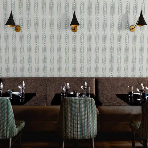 Bang For The Buck Vertical Stripes Vinyl Wallcovering Featuring Subtle Leather Texture in a restaurant setting with green chairs.