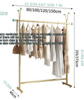 Beefy Heavy Duty Clothing Rack With Hooks For Home And Laundry Movable Clothes Rail In Gold Finish Industrial Style displaying clothes