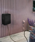 Hella Tough Weatherproof Electric Vehicle Charger Cover For Tesla Wall Connector Level 2 Charging Station mounted on wall.