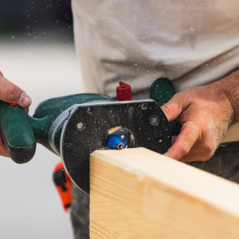 Using a router from 24 Piece Quarter Inch Shank Tungsten Carbide Router Bit Set for Woodworking Pros and Beginners on wood