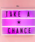 Cinema Lightbox Letter Board 12x9 Inch With 100 Letters, pink RGB glow, displaying 'TAKE A CHANCE' on pink background.