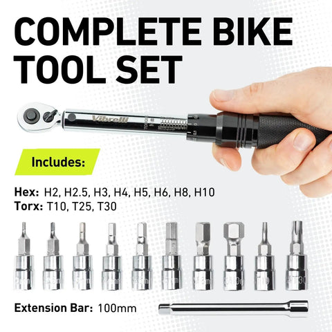 Hand holding Dialed In Bike Torque Wrench Set For One Quarter Inch Drive With 2 To 20 Nm Range, showing hex and Torx bits