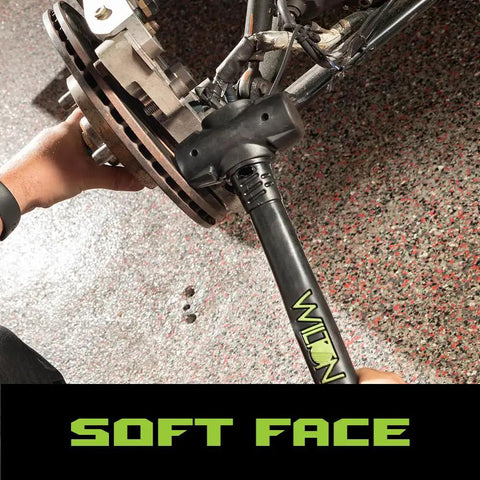 14 Inch Dead Blow Hammer With Beefy 3 Pound Head in use on metal, featuring spark resistant and no slip ergonomic handle.