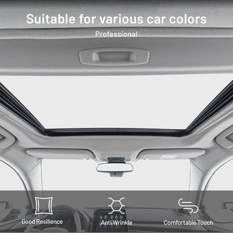 Gray auto headliner fabric with foam backing installed in car interior over sunroof.