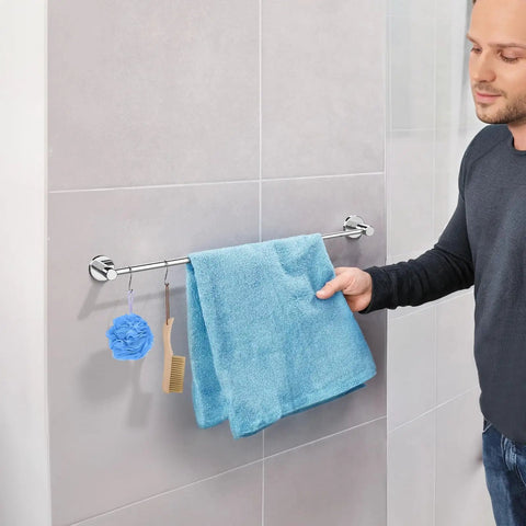 Man holding towel on 2 Pack Adjustable Single Bath Towel Bars 16 To 27 Point 6 Inches Chrome Finished Stainless Steel Towel Holder Hanger