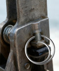 Close-up of stainless steel cotter ring installed on a metal joint, part of 80 Piece Stainless Steel Cotter Ring Kit With Five Sizes