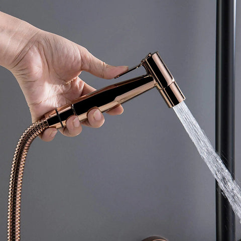 Top Shelf Wall Mounted Rain Shower Combo Set With Smooth Handheld Sprayer And Bathtub Faucet Featuring Sleek Rose Gold And Matte Black Finish, hand holding the sprayer.