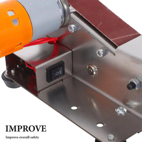 Plug And Play Mini Electric Belt Sander With Twenty Emery Belts Heavy Duty Desktop Grinder close-up of motor and power switch.