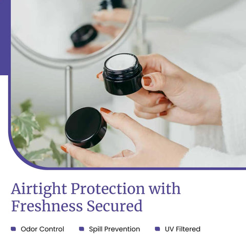 Sleek Black Glass Storage Jar With Airtight Seal Keeps Your Goodies Fresh And Secure in hands with lid off showcasing contents.