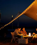 Torch Replacement Canisters For Bamboo Lanterns, Refillable Outdoor Torches illuminating a nighttime garden party under a canopy.
