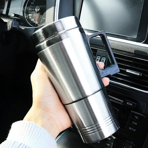 Dual Voltage Car Kettle For 12V And 24V Vehicles With Insulated Stainless Steel Interior held in hand inside vehicle.