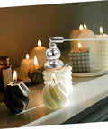 Christmas Metal Candle Fire Extinguisher Cap With Long Handle above glowing candles on a table, showcasing elegant snuffing.