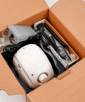 Box containing 35K RPM Carbon Brush Micro Motor Drill with cables, foot pedal, and components for polishing and shaping nails.