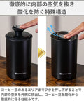 Premium Vacuum Sealed Coffee Canister With Airtight Seal And Light Proof Stainless Steel demonstrating air removal process.