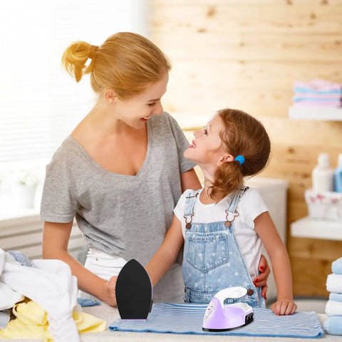 Portable Mini Heat Press Machine With Charging Base For DIY T Shirts Bags And Hats Light Purple compact small iron next to mother and daughter.