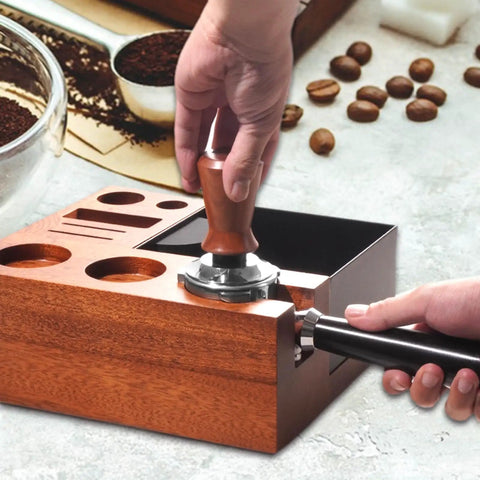 Solid Wooden Espresso Tamping Station With Fully Integrated Knock Box And Precision 58Mm Tamper Stand For Sapele Wood in use with tamping tool.