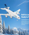 Ready To Fly 2.4GHz RC Airplane Toy With Gyro A380 Style Foam Jet flying over snowy trees under blue sky