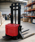 Maneuverable Narrow Aisle Pallet Jack For Easy Warehouse Hauling with a red base and slim design, ideal for tight spaces.