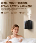 Chill Out Your Space With This Waterless Essential Oil Diffuser wall-mounted above a person in a bathtub, emitting cold vapor.
