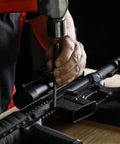 Person using Heavy Duty Built To Last Pro Grade 16 Piece Punch And Chisel Set with tapered punch on a firearm.