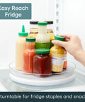 Hassle Free 360 Spin Fridge Turntable showcasing bottles and sauces on a round tray in fridge for easy access.