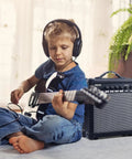 Child playing guitar with 20 Watt Portable Electric Guitar Amplifier With Headphone Input And Gain Control For Quiet Practice