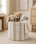Slick Striped Woven Storage Basket With Beige And White Accents holds stuffed animals and blanket in a kid's room.