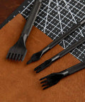 4 Piece Leather Stitching Punch Set With 1 2 4 6 Prongs on leather surface