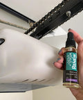 Person applying Renew Natural Household Oil Unscented All Purpose Lubricant Spray For Doors Hinges And Locks Eco Conscious.