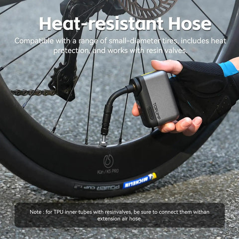 Cyclist using Ultra Portable Mini Bike Tire Pump With Digital Gauge And Auto Stop At 120 PSI Type C Rechargeable Battery