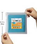 Hands holding packaged 4 Pack Fluorescent Light Covers 4 By 2 Feet Magnetic Attachments Tranquil Blue Easy Install Flame Retardant Fabric