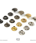 Assorted metal snap fasteners displayed in rows, showcasing different finishes and designs for crafts.