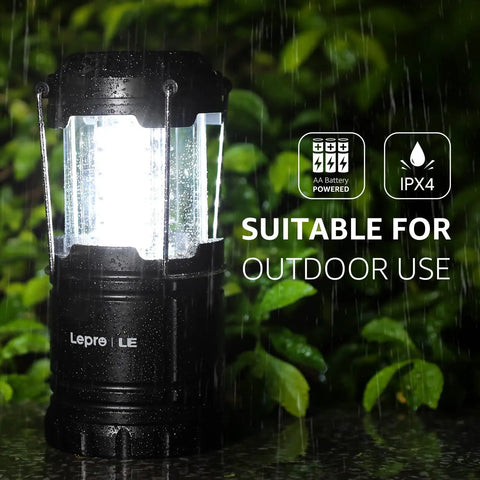 LED Lanterns Battery Powered For Camping And Outdoors, collapsible design in rain with IPX4 water resistance and AA battery symbols.