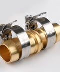 Angled side view of brass 5/8-inch hose joiner with stainless steel clamps for garden hose repair