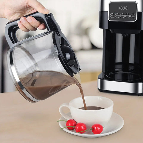Pouring coffee from the coffee pot of the Top Shelf Automatic Drip Coffee Maker And Espresso Brewer For Home Office.
