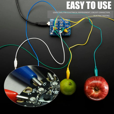 10 Piece Premium Electrical Crocodile Alligator Clip Test Lead Kit with fruits, circuit board connection shown.