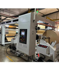 Industrial Smooth Operation Heavy Duty Automatic Jumbo Roll Slitter Machine Featuring Differential Slip Shaft For Insulation Paper Sheets setup with large roll.