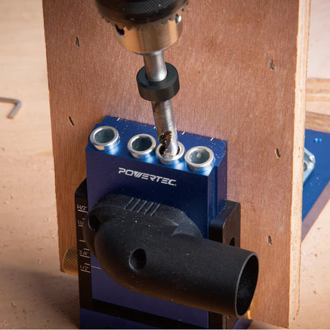 Workhorse Pocket Hole Drill Bit Set With Depth Stop Collar for precise woodworking, shown drilling into wood using a jig by POWERTEC