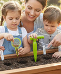 Family using 14 Pcs Seed Dispenser Set for Garden Hand Planter and Seeder Tool with Dibber, Hole Puncher, and Labels in garden
