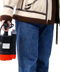 Person holding a Badass Submersible Sump Pump Delivering Rock Solid 2500 GPH Flow For Basement Flood Clearing And Backyard Pool Drains Constructed From Rugged Thermoplastic Material With 10 Ft Cord.