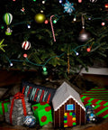 Christmas tree with colorful decorations and gifts, including a Galaxy Printed Duct Tape Roll For Crafts And Repairs box.