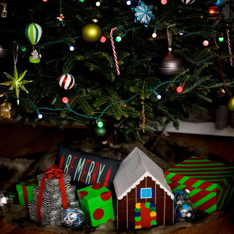 Christmas tree with colorful decorations and gifts, including a Galaxy Printed Duct Tape Roll For Crafts And Repairs box.