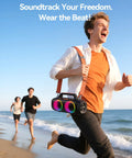 Man running on beach holding Roar 1 Portable Bluetooth Speaker With 60W Power And JIKE Bass Algorithm Delivers Deep Bass At All Volumes