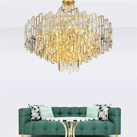Sleek Crystal Ceiling Pendant Light With Modern Designer Shape And Energy Efficient Led Bulbs For Living Room Or Dining Area above green sofa.
