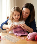 Mother and daughter using Quick Gauge Ruler For Knitting And Crochet No Sweat Stitch Measurement Tool With Clear Grid Layout.